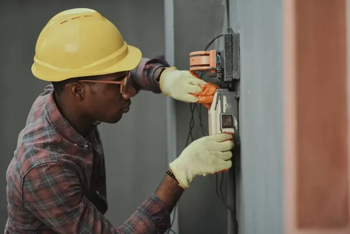 Electrician using tools for a home repair