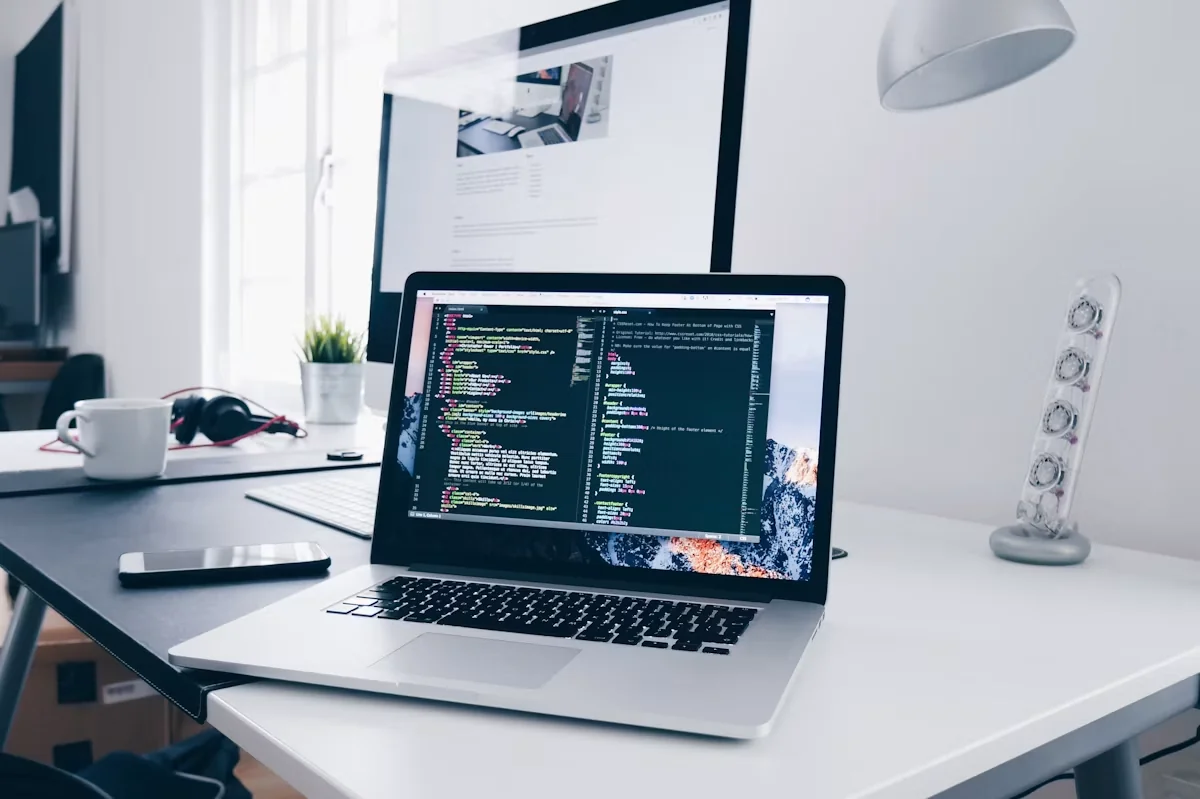 Website development workspace with computer screens