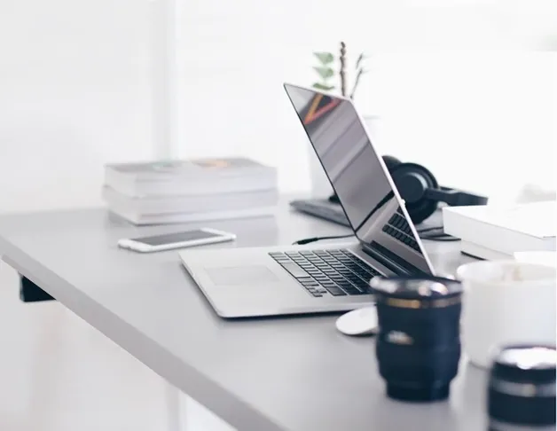 Legal planning workspace with laptop and reference materials