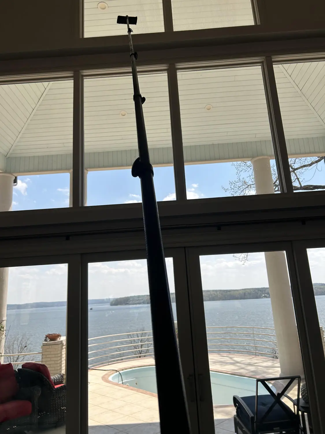Professional pole cleaning tall interior windows
