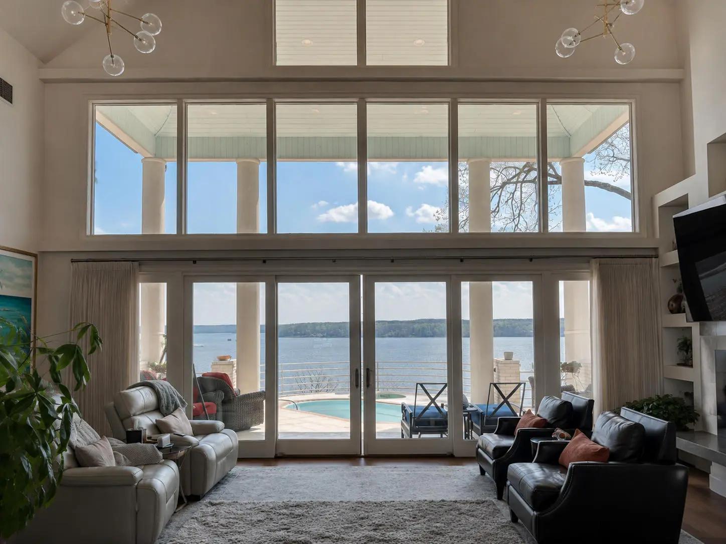 Luxury lakefront home with large clean windows overlooking the water
