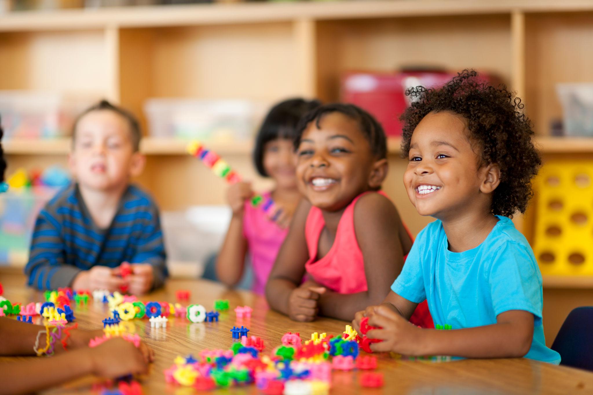 Smiling children in a warm pediatric daycare setting